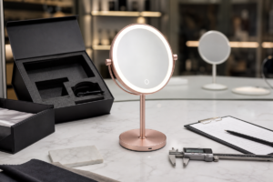 Mirror development process cover with complete LED makeup mirror sample approval packaging calipers and factory production background